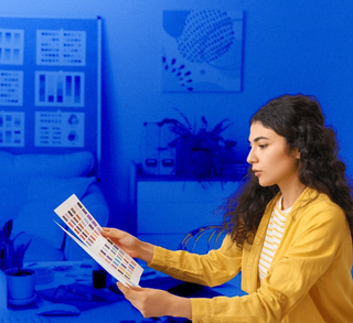 woman looking at a colour sheet