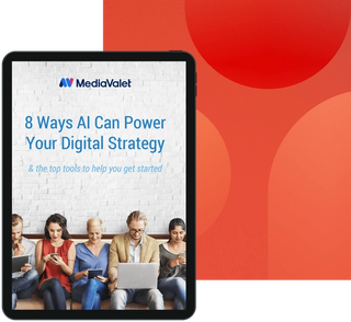 Eight ways ai can power your digital strategy eBook with the mediavalet logo, with four women sitting on a couch looking at their cellphones in business attire on a geometrics red faded background