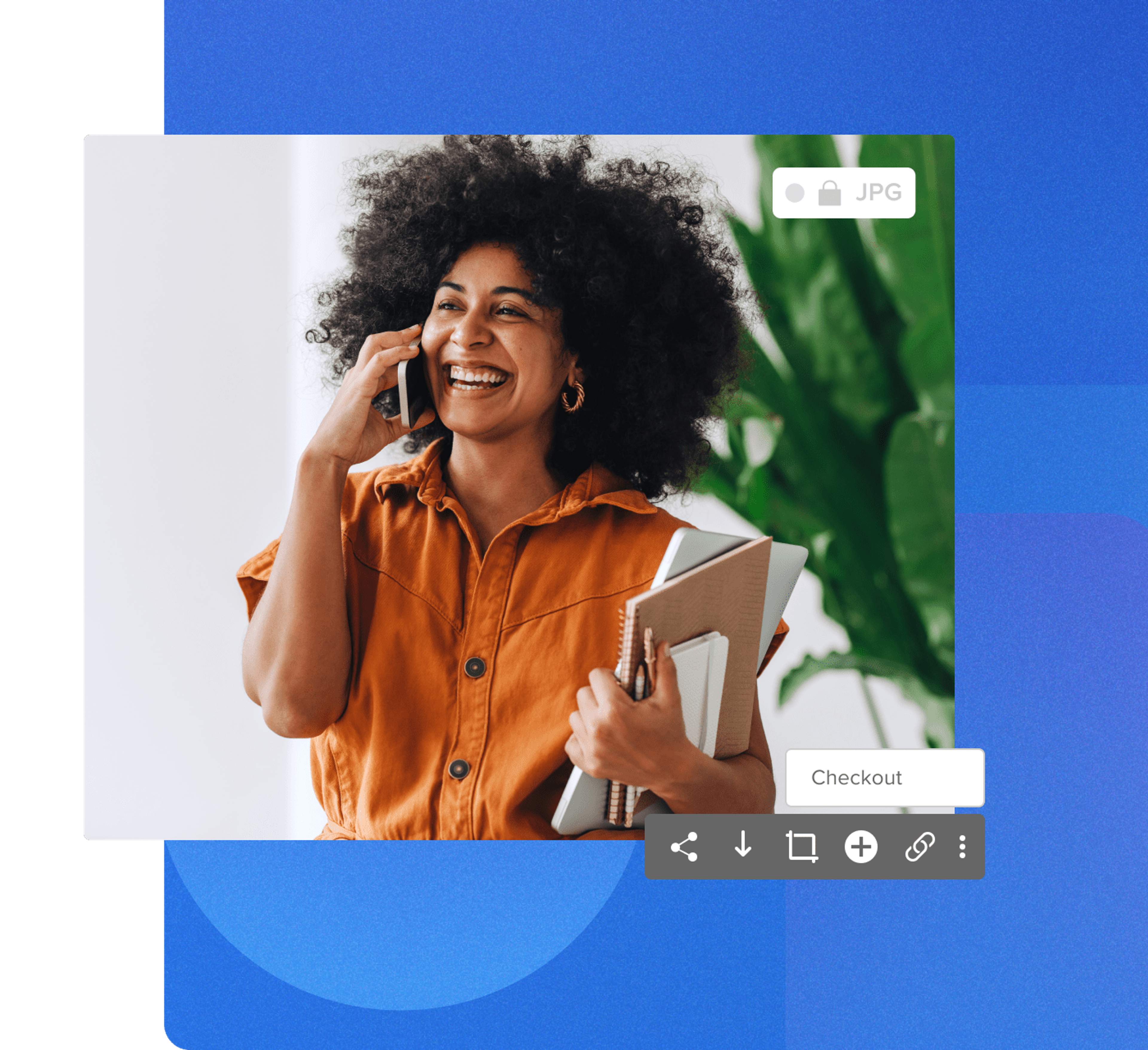 Women talking on an cellphone, smiling holding a laptop and notebooks, wearing a orange jumpsuit with a plant behind her on a geometric blue background