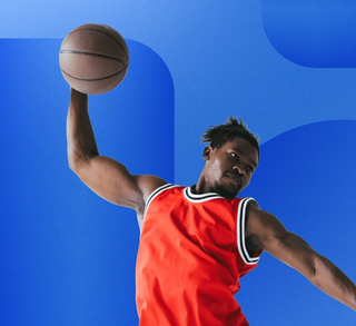 man jumping with basketball