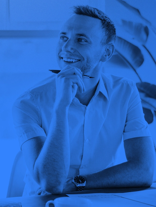 man thinking with pen in hand