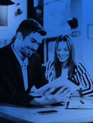 man and woman reviewing a tablet