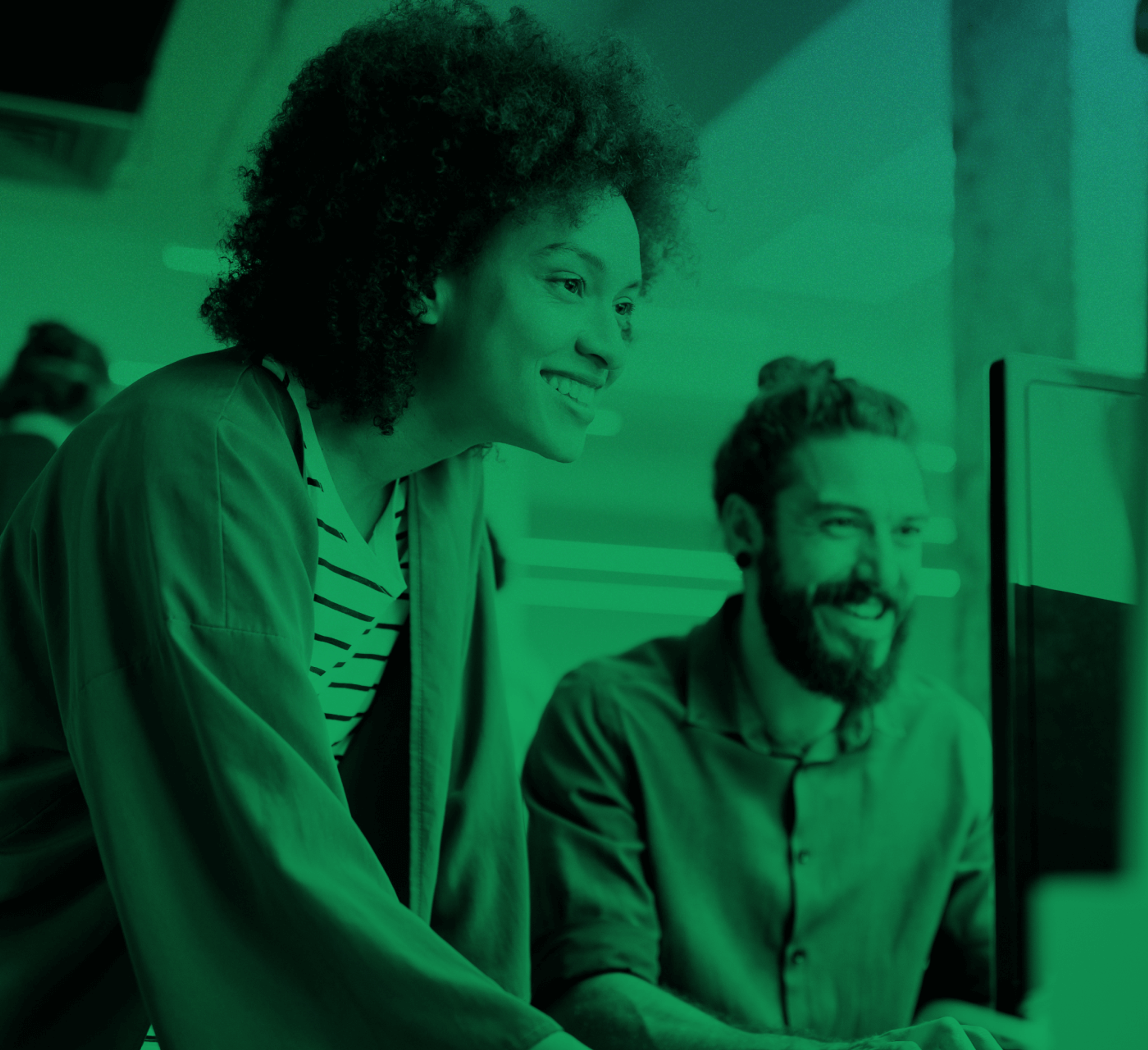 man and woman reviewing computer screen