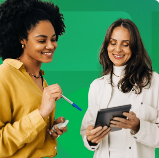Women smiling with a white turtle neck holding a tablet with a women wearing yellow clothing pointing down with a pen and notepad on top of geometric green background
