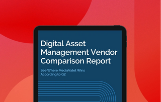 The G2 DAM vendor comparison report cover on a tablet with mediavalet logo, red circle and white lines on top of a faded red geometric shapes background