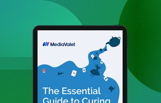 Blue and white eBook cover of the essential guide to curing content chaos - 5 steps to take control of your digital content - complimentary workbook included with the mediavalet logo on a geometric green background