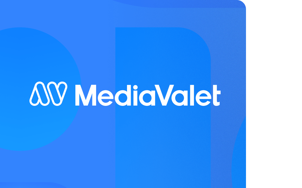 White mediavalet logo on a two-toned blue background with geometric shapes