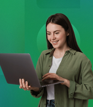 Women with long dark brown hair, in a green button-up shirt, holding a laptop, smiling and typing with a geometric green background