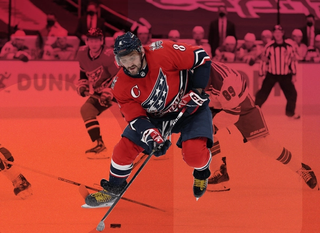 Hockey player number 8 hitting a puck on a magenta gradient background