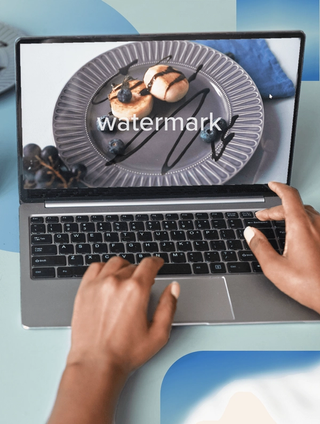laptop with watermark on screen