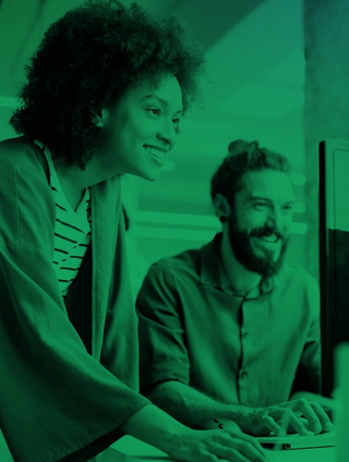 man and woman reviewing computer screen