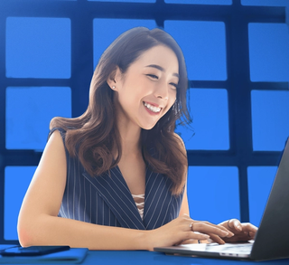 woman smiling at computer