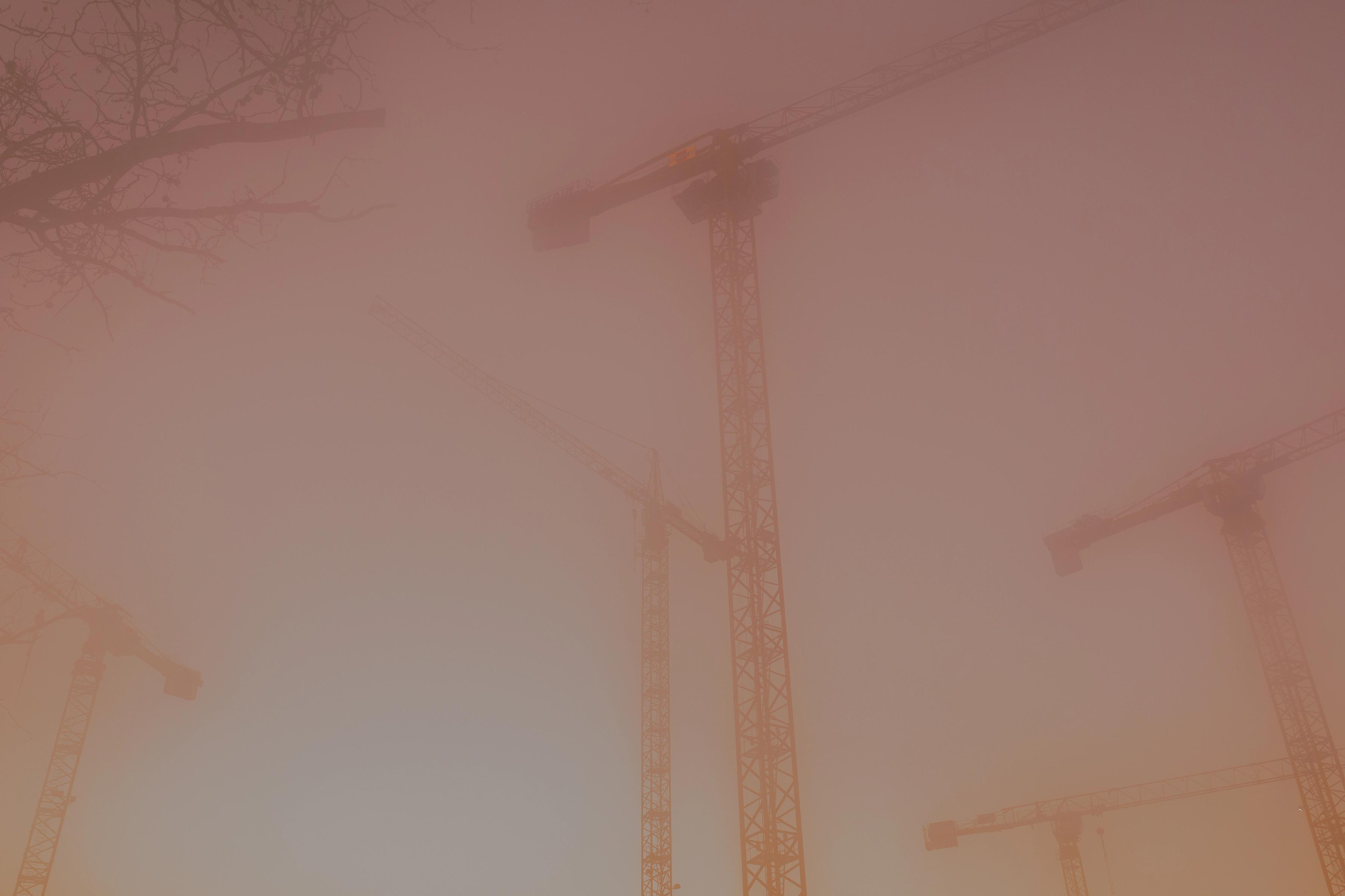 foggy cranes construction life