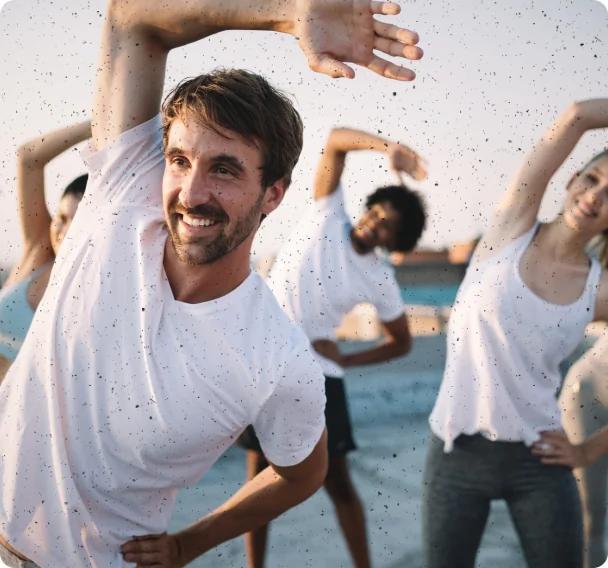 People in a group workout stretching