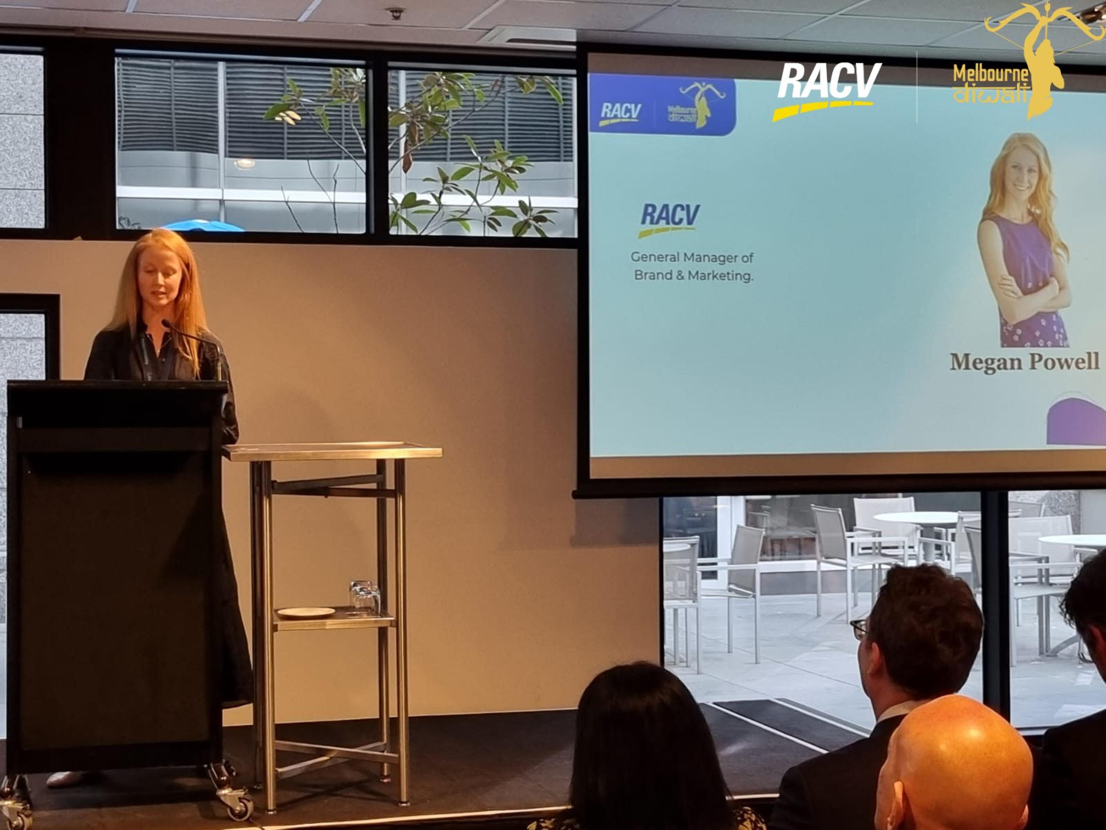 Megan Powell, General Manager of Brand and Marketing at RACV, speaks beside her name slide