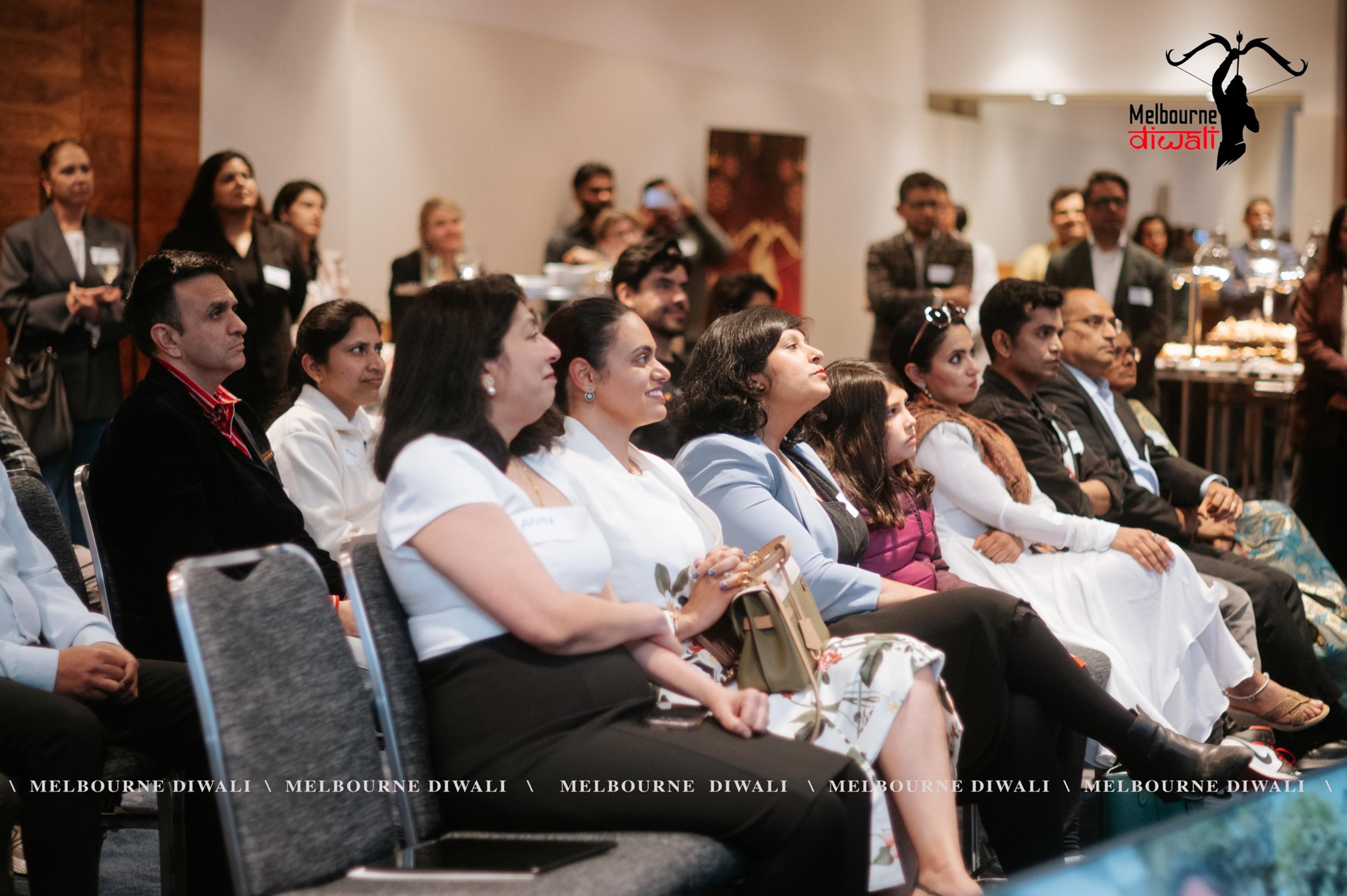 Guests in the front rows listen to the programme