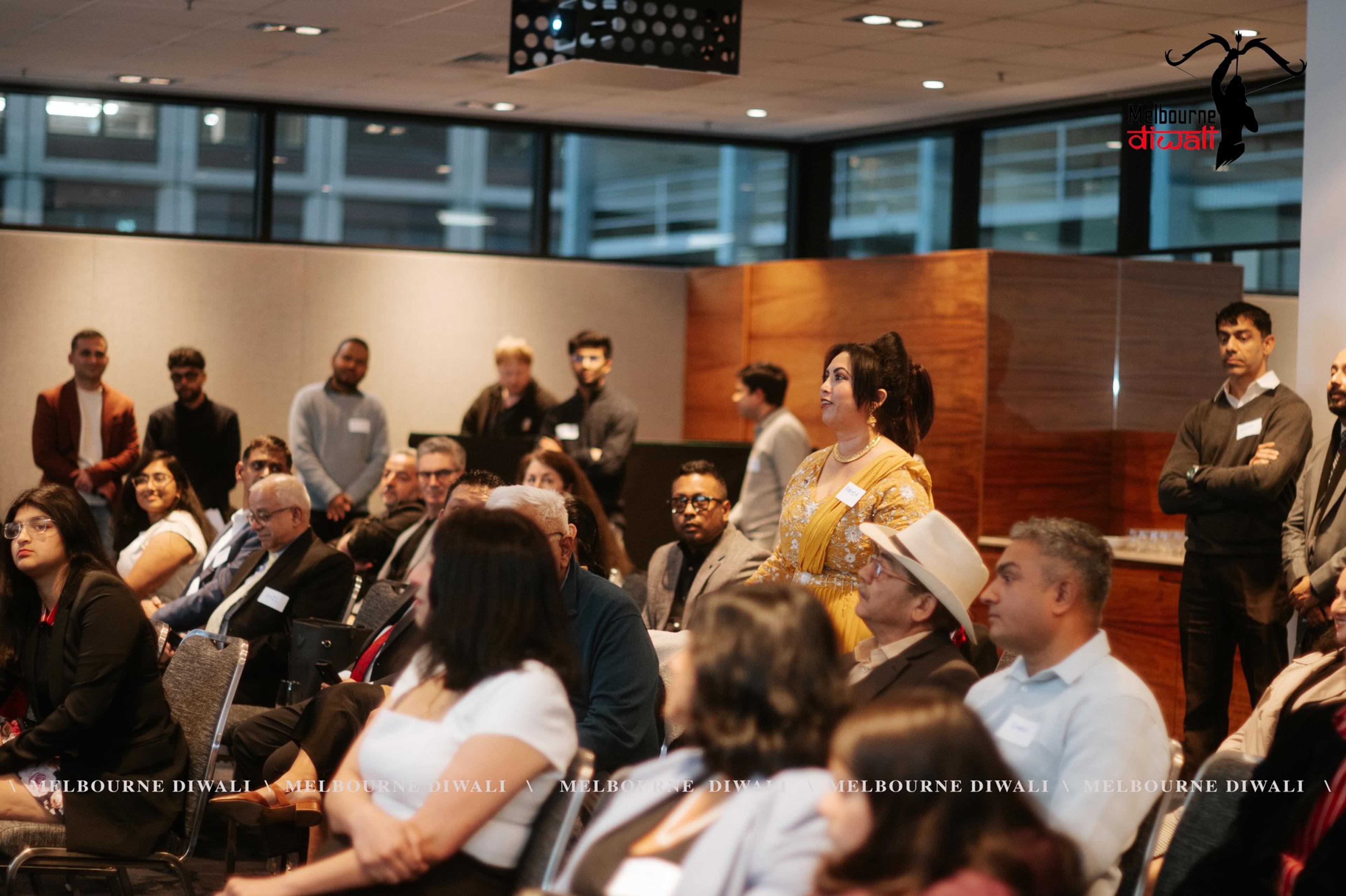 The seated audience, with guests standing along the back of the Launch room