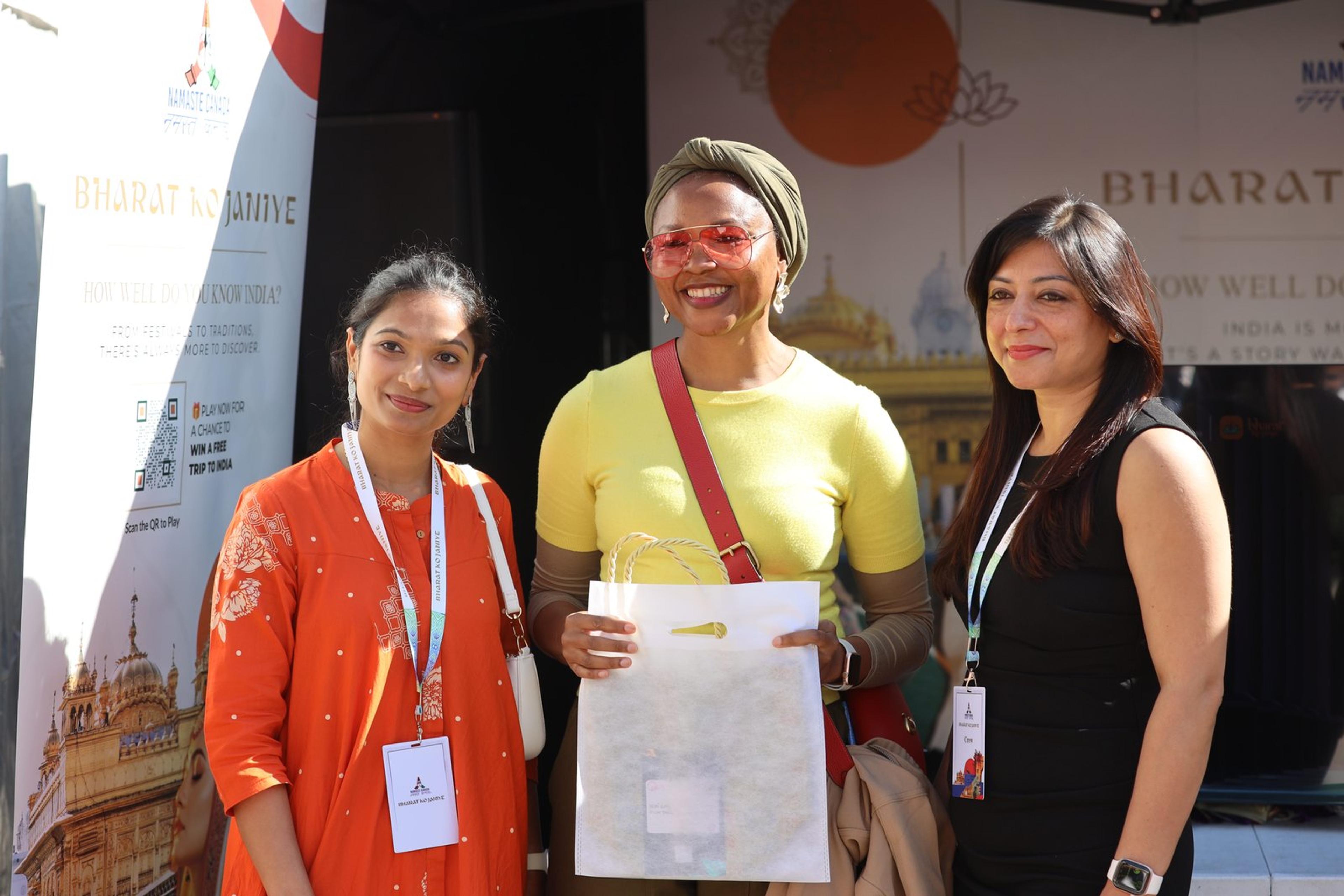 Visitors with a giveaway bag at the Bharat Ko Janiye stall