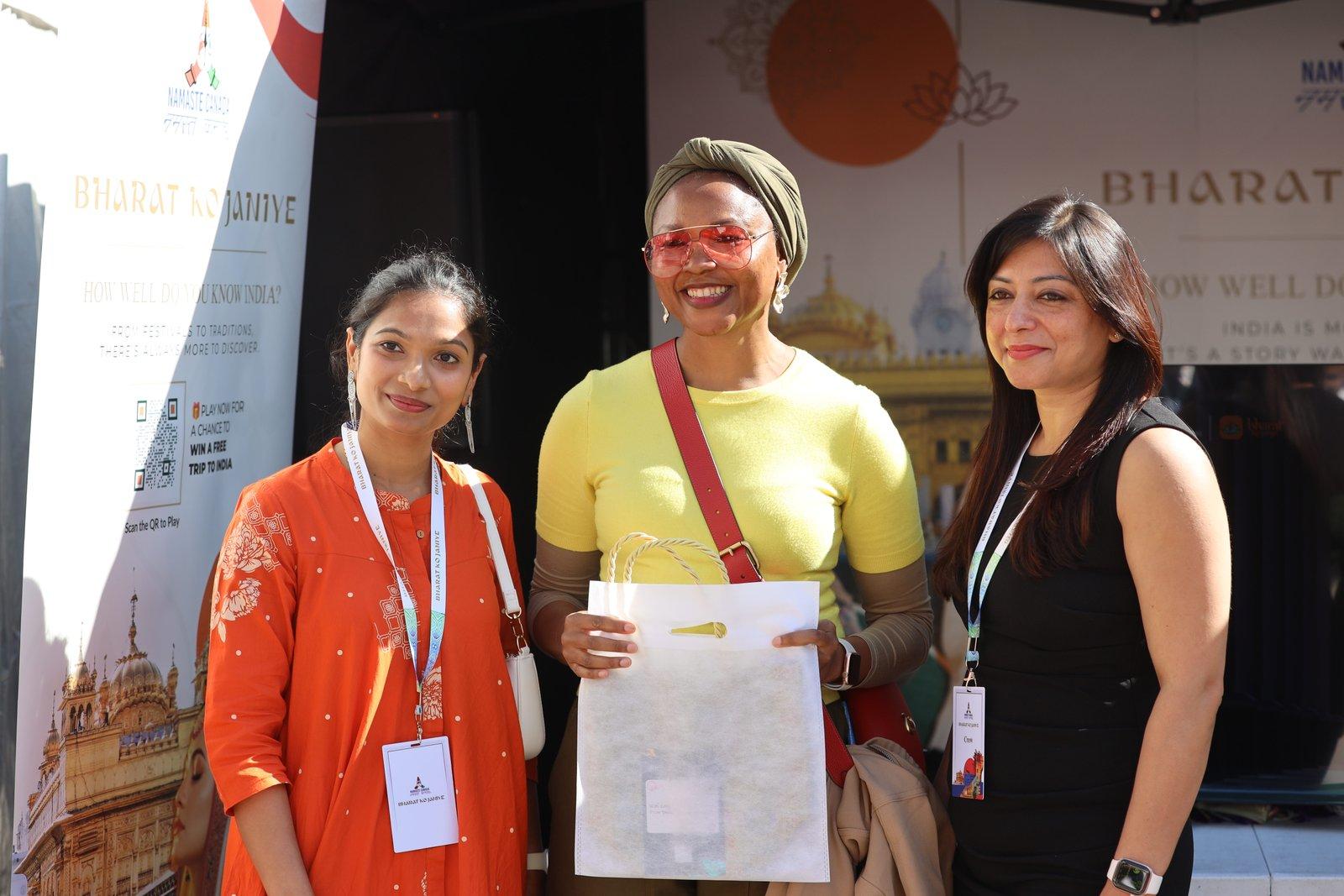 Visitors with a giveaway bag at the Bharat Ko Janiye stall
