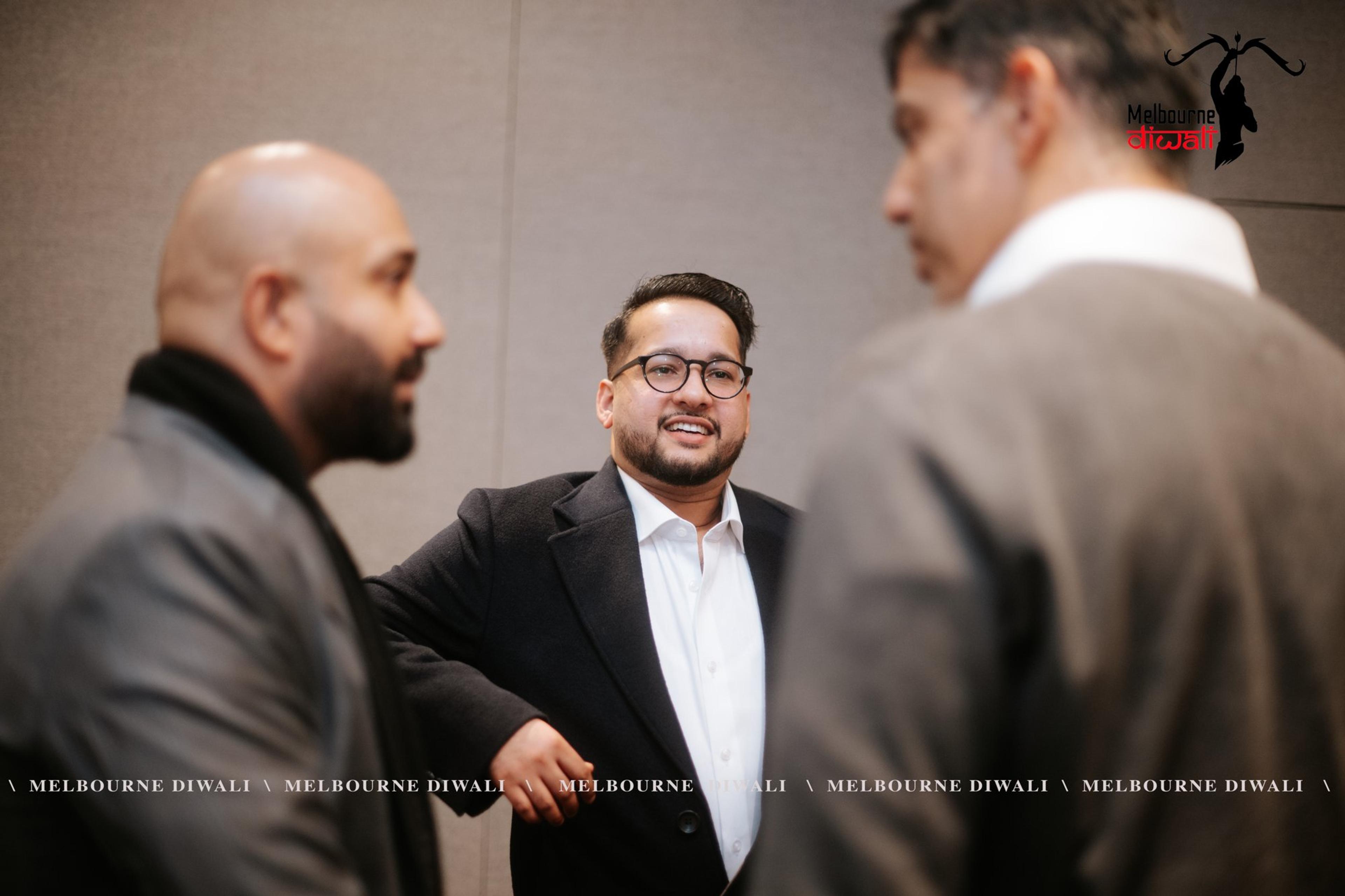 Three guests in conversation during networking