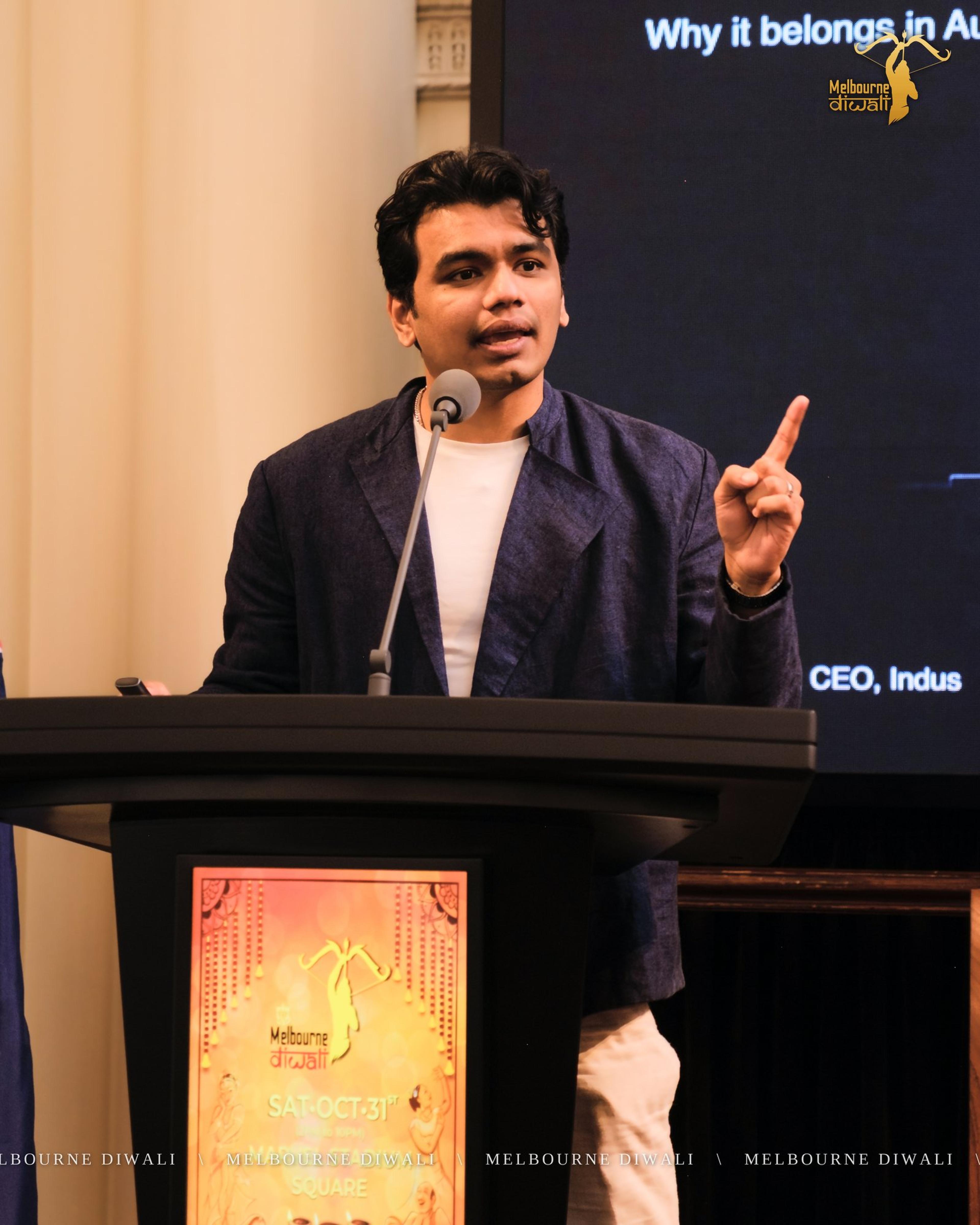 Jai Goradia, Founder and CEO of Indus, speaks at the lectern