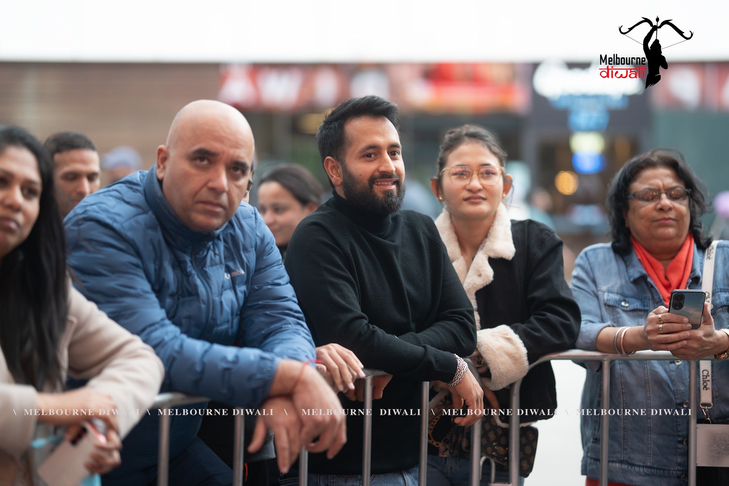 Festival-goers watching the main stage, 2025
