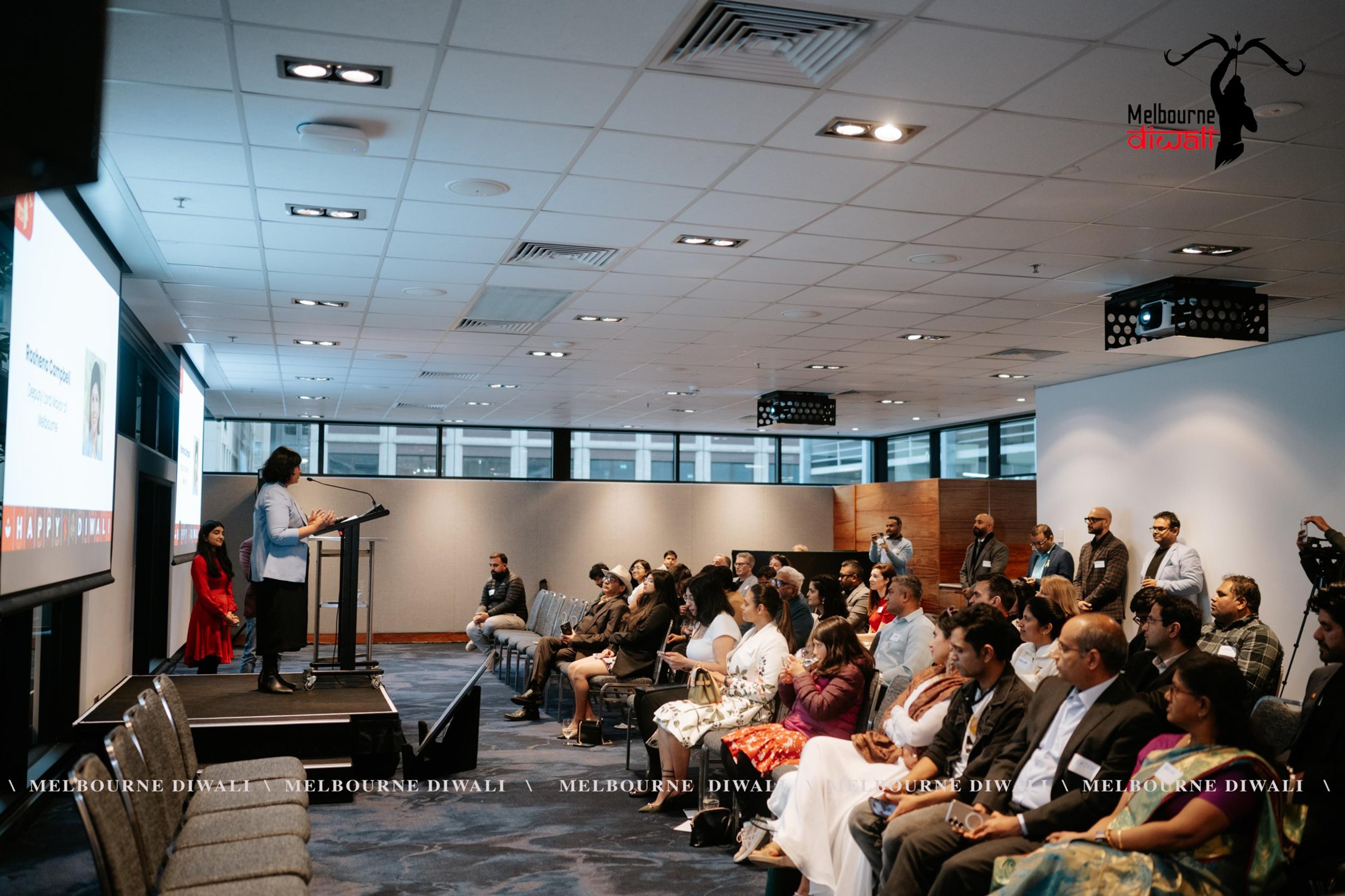 The Launch room from the back as a speaker presents at the lectern