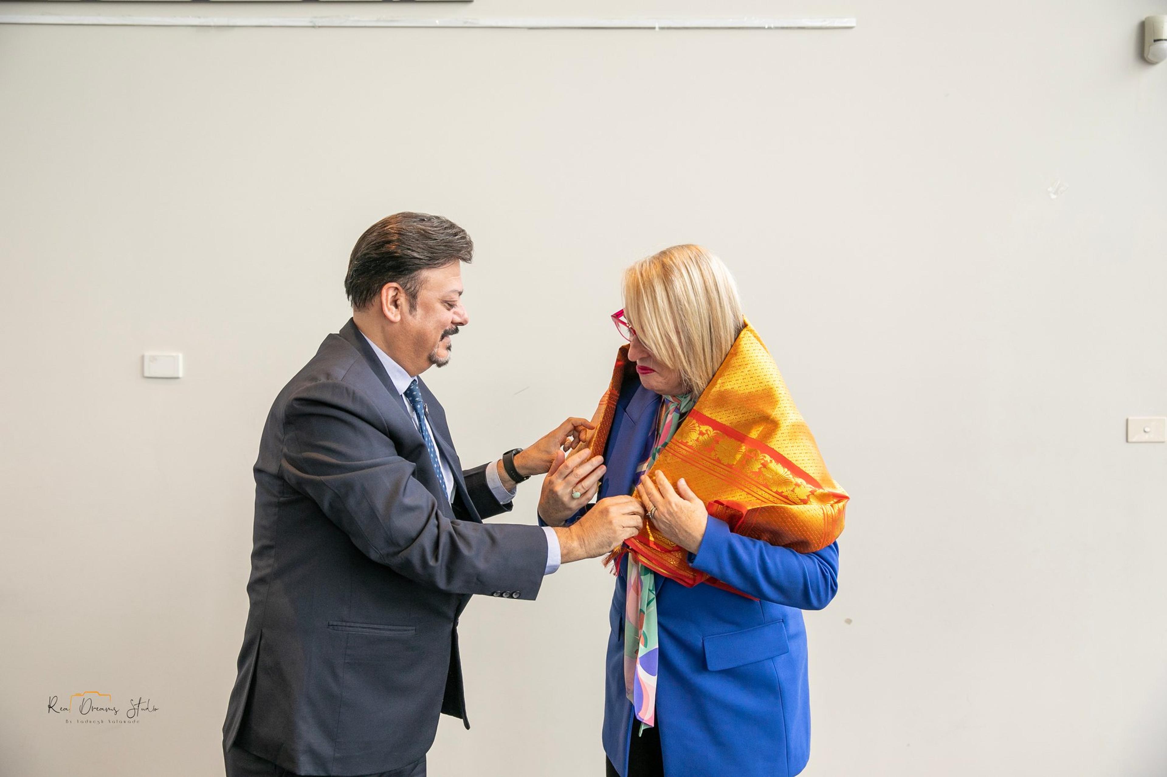 A shawl is placed on Lord Mayor Sally Capp