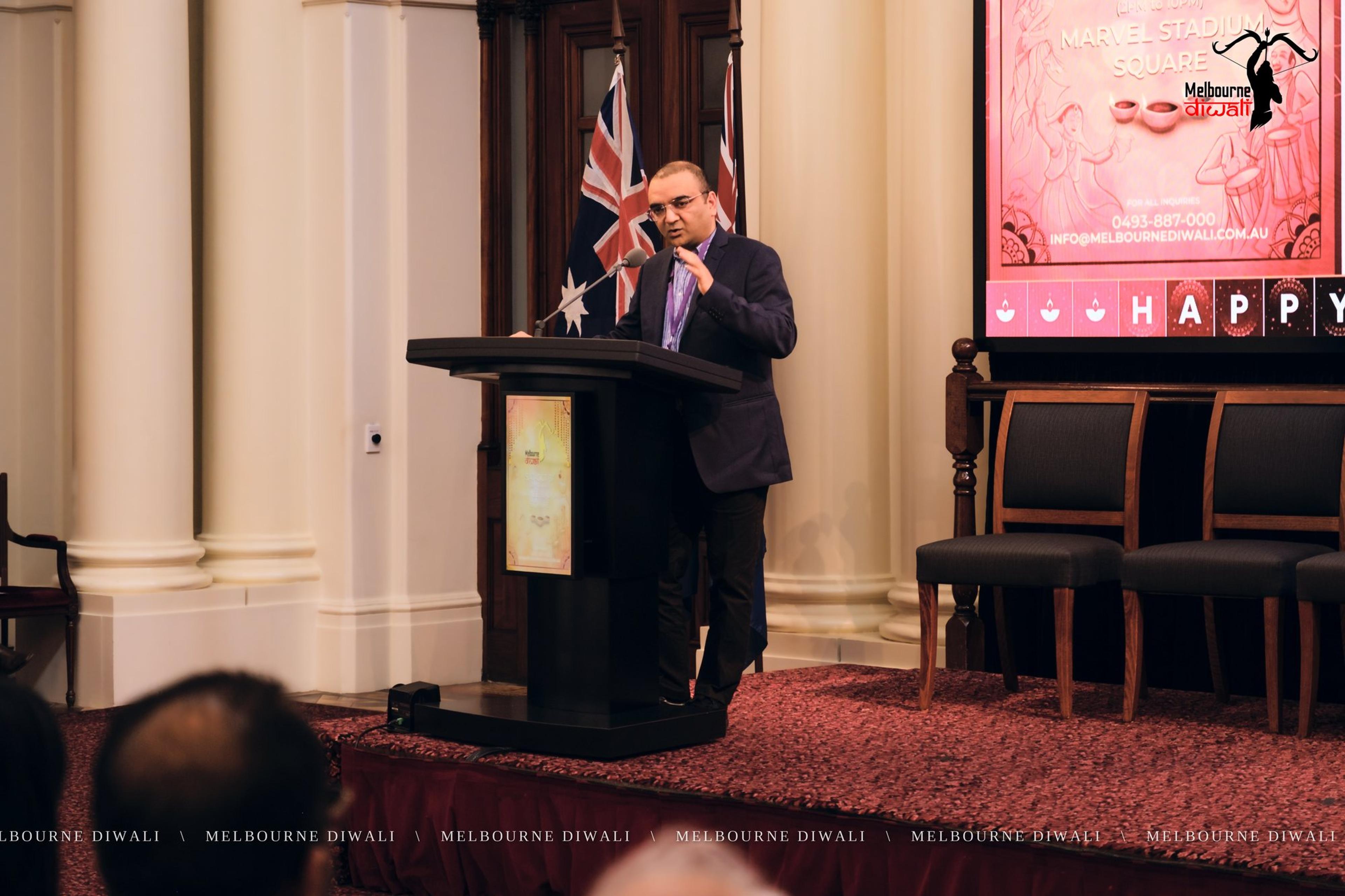 Gautam Gupta gives the vote of thanks at the lectern