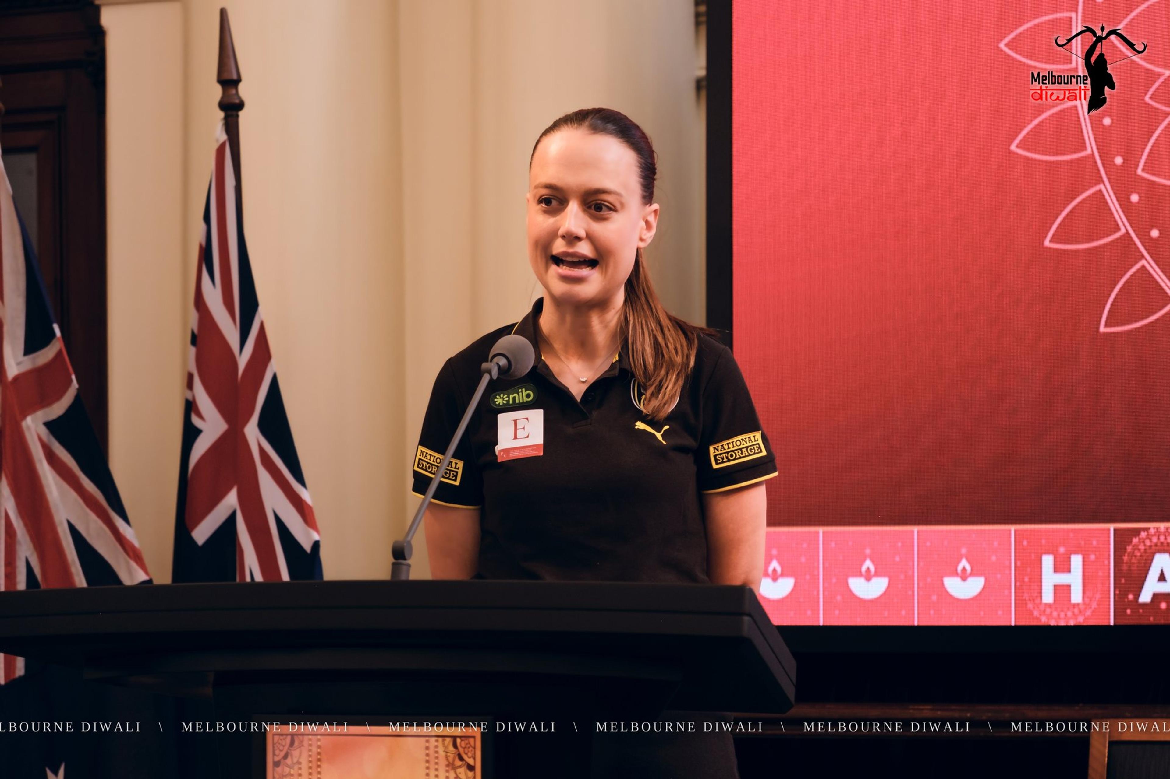 Gemma Ellis of Richmond Football Club speaks at the lectern