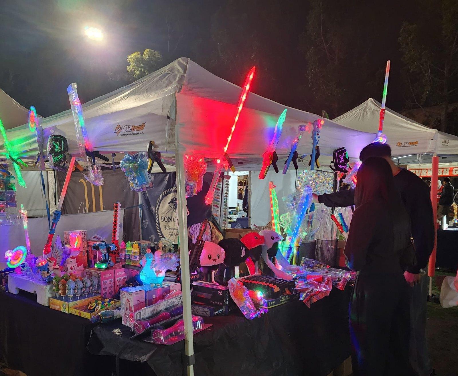 Kids Glow stall lit up at night