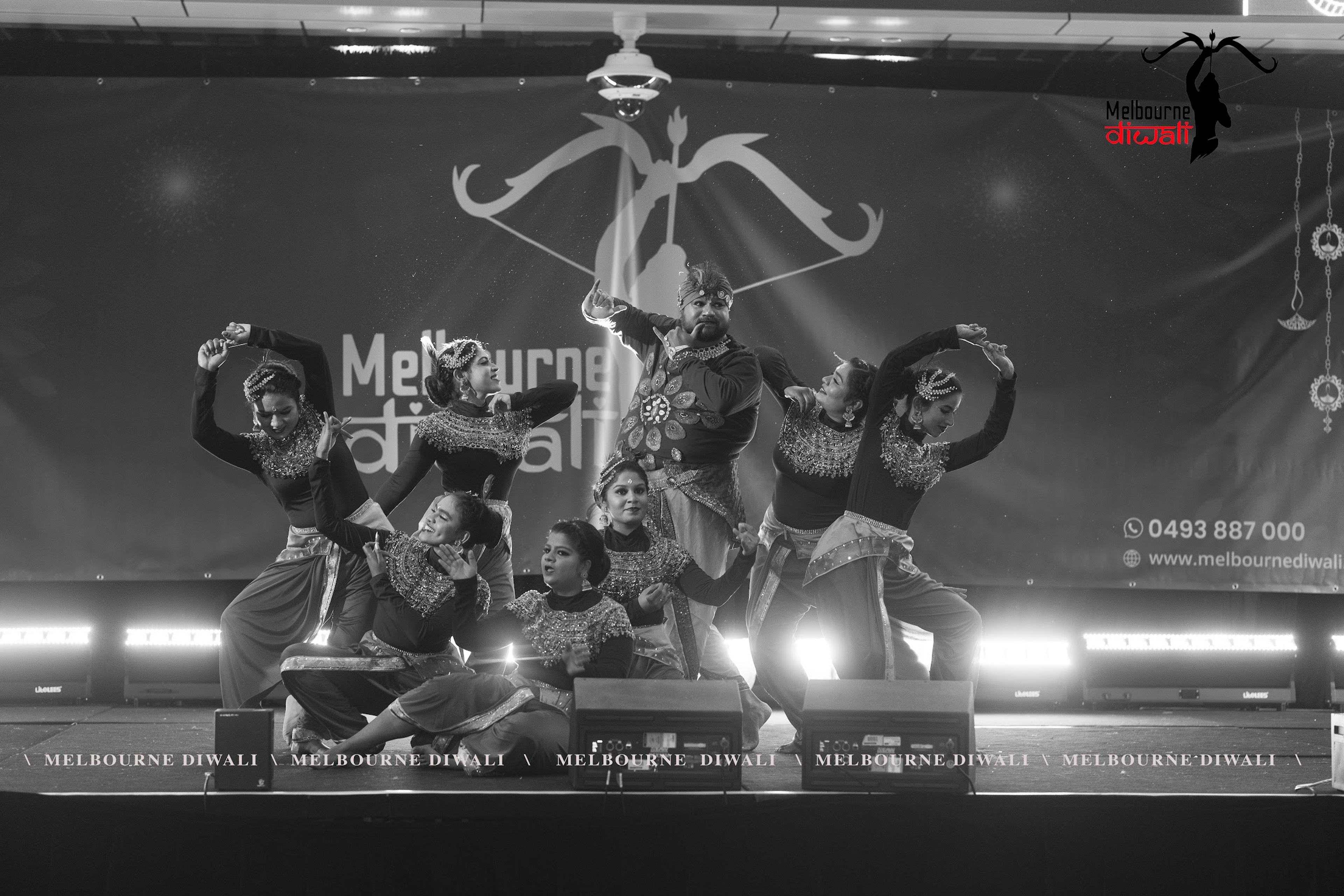 A dance troupe holds a final formation on the main stage at Melbourne Diwali 2025
