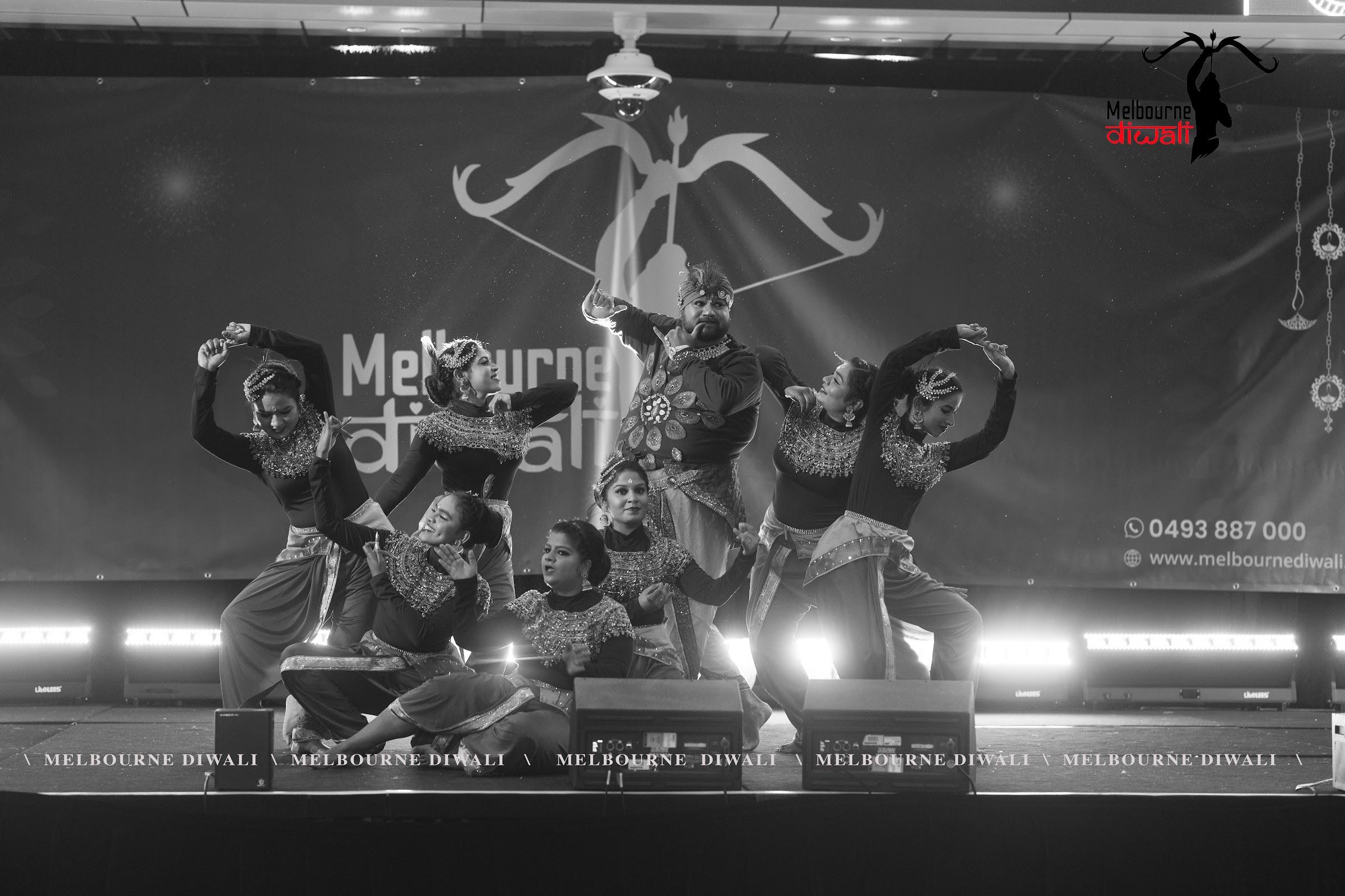 A dance troupe holds a final formation on the main stage at Melbourne Diwali 2025