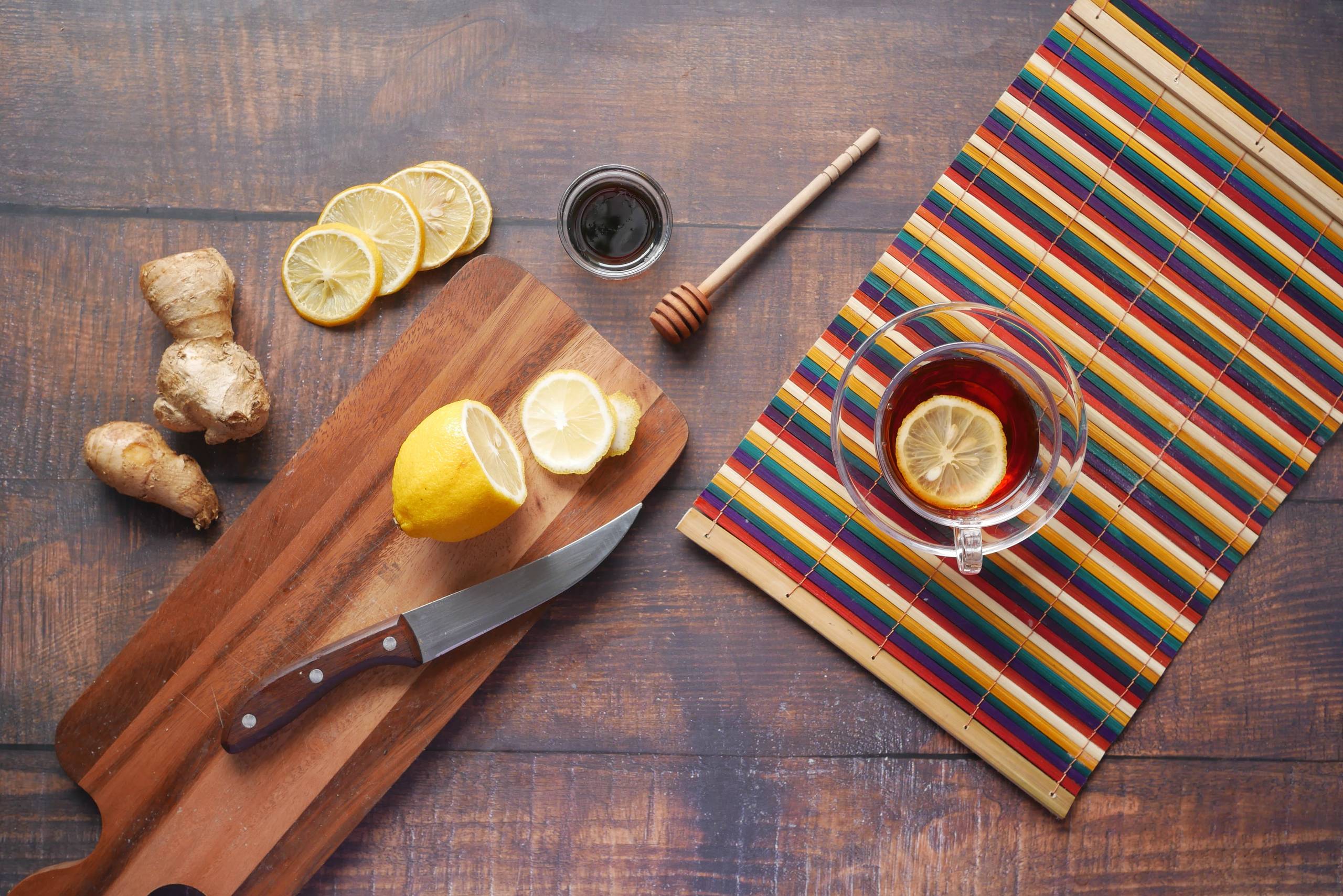 lemon, ginger and honey on a cutting board