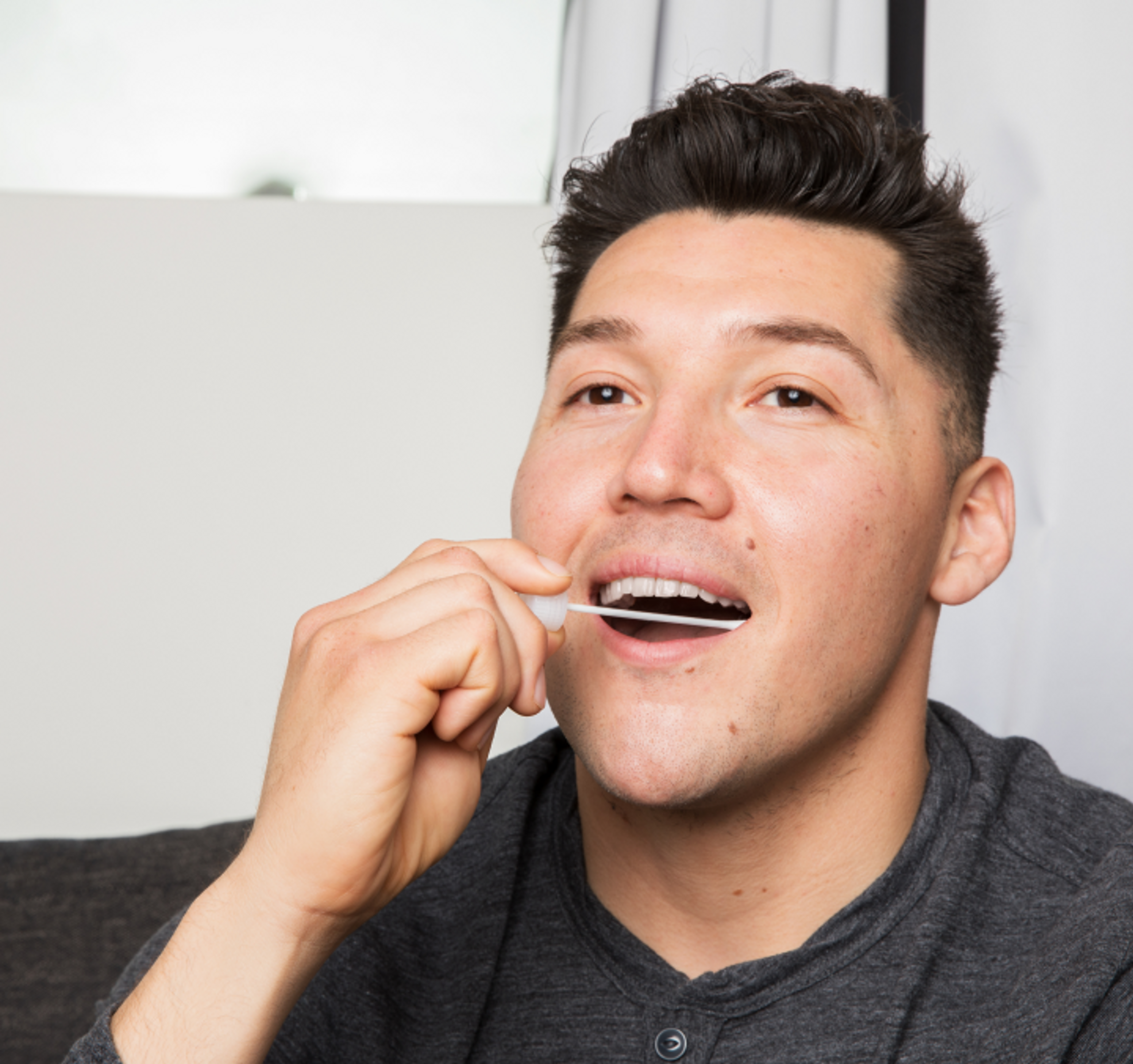 image of man taking DNA test