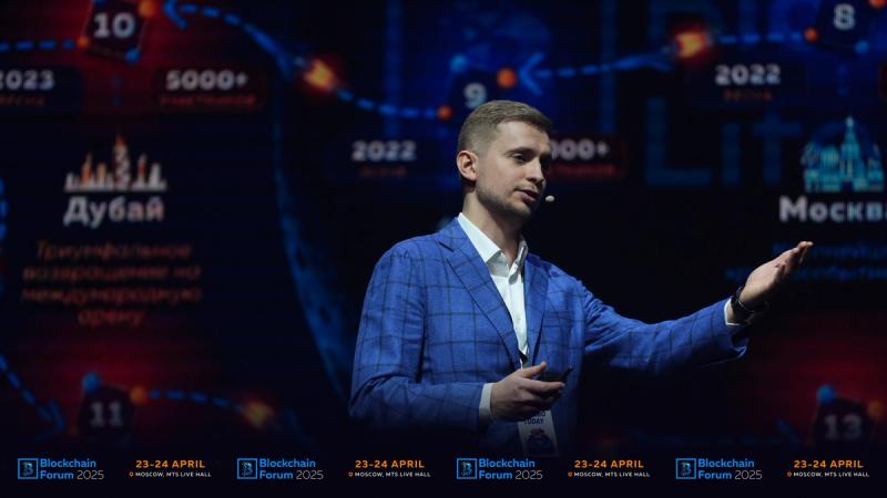 Zoomed-in view of a speaker standing and speaking on stage