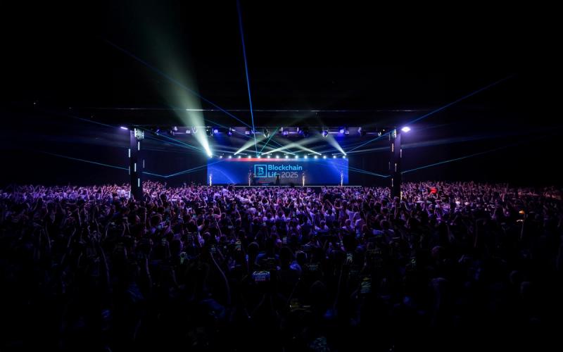 The main Blockchain Life main stage with the audience listening to the debate.