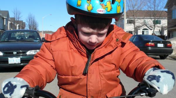 Boy learning to ride a bike