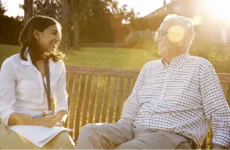 A senior talks with an assisted living director