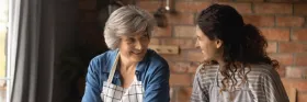 Senior and daughter in kitchen