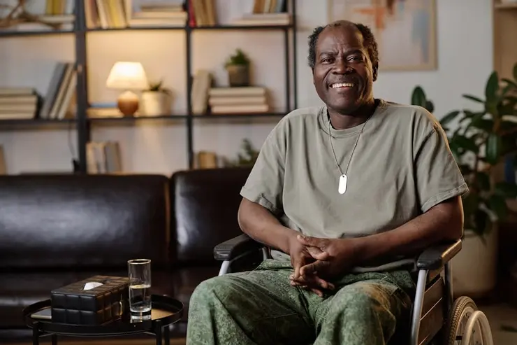 Disabled veteran in wheelchair at home.