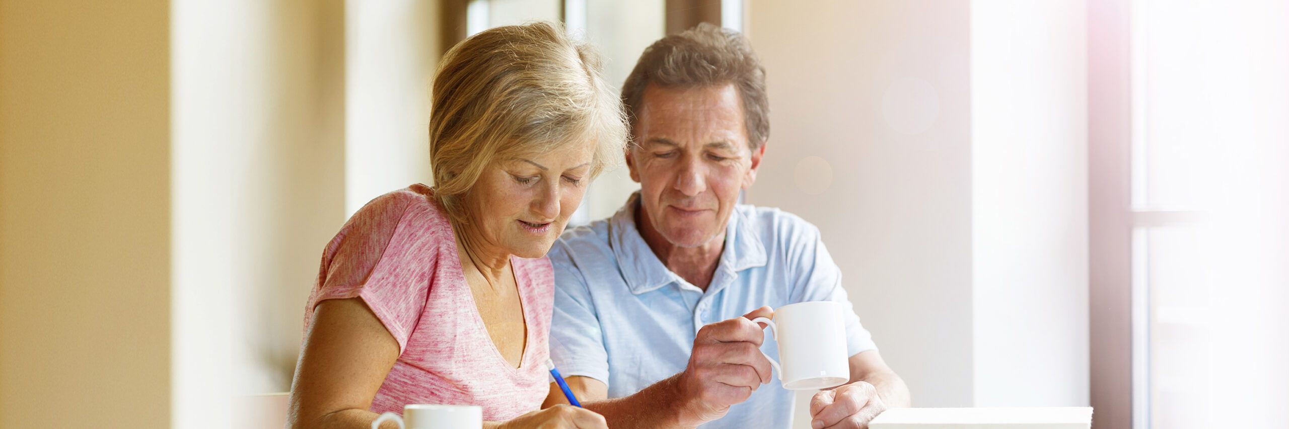 Seniors looking at paperwork together