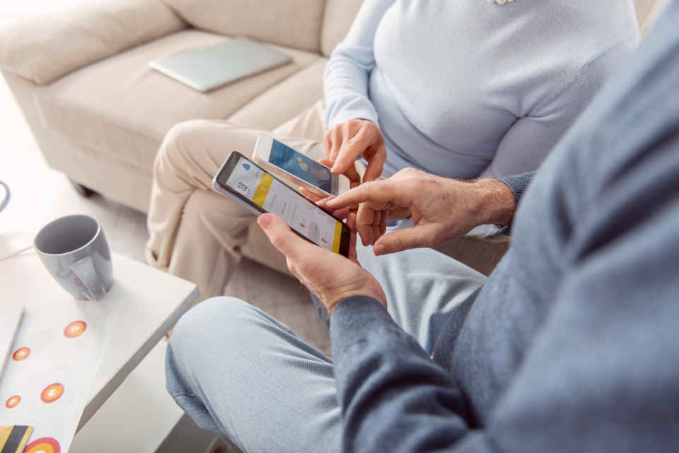 Caregivers accessing apps on their phone to help with their key tasks
