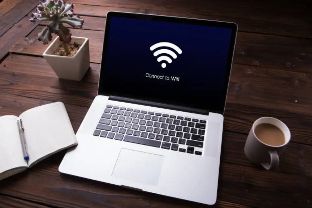 student laptop connected to campus wifi studying