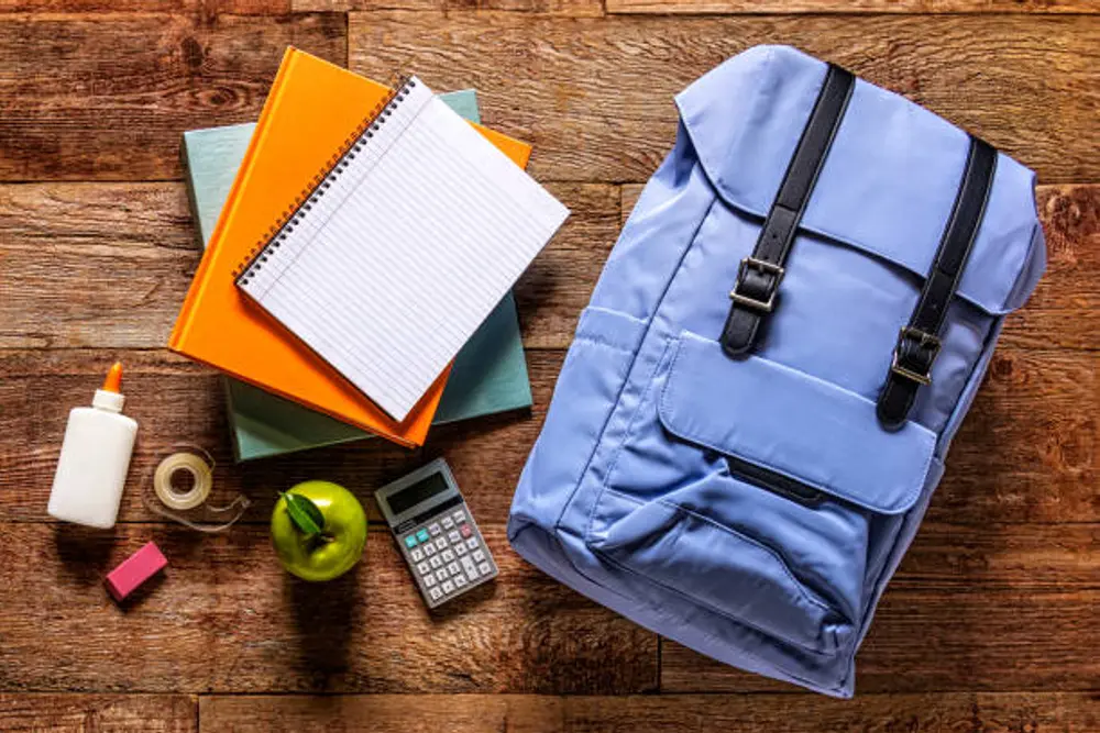 university student backpack essentials packing flat lay