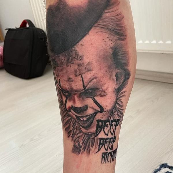 a cover-up tattoo of a joker with a hat on it, augsburg, germany