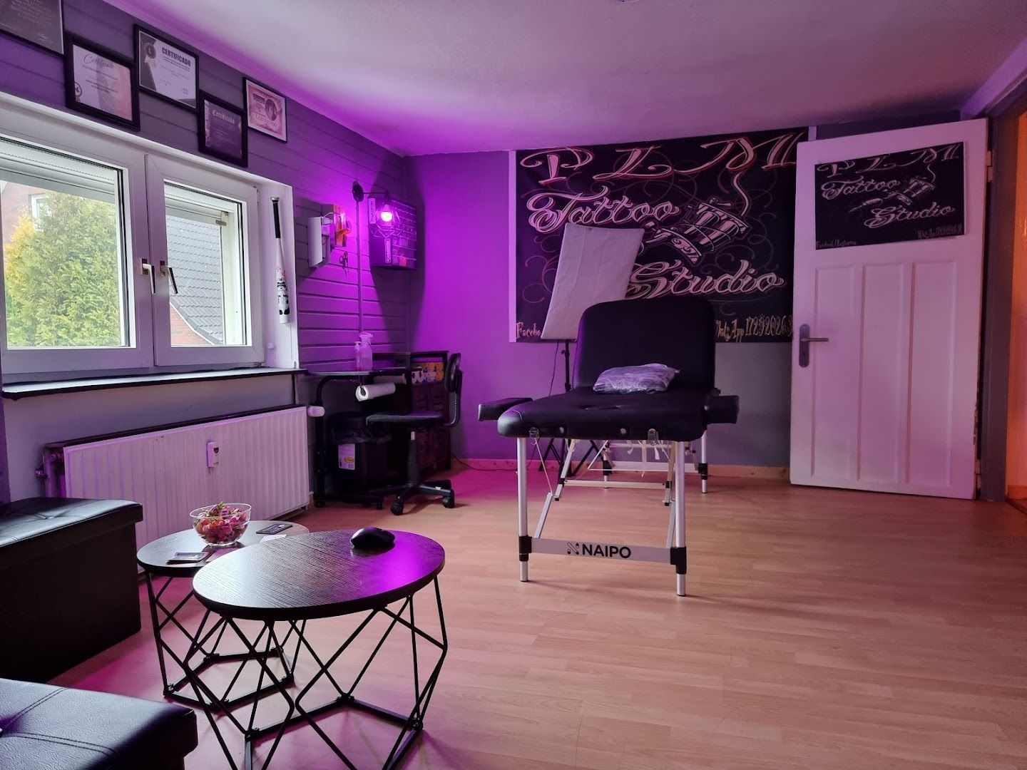 a room with purple walls and a blackboard