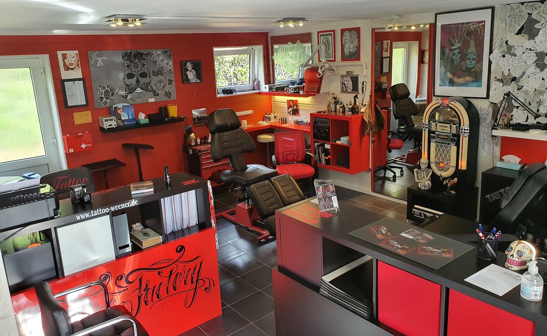 a room with a lot of red and black furniture