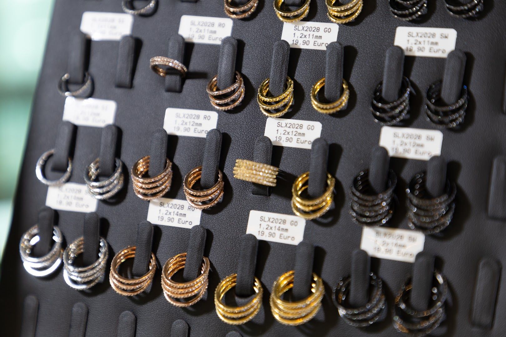 a display of gold and silver rings