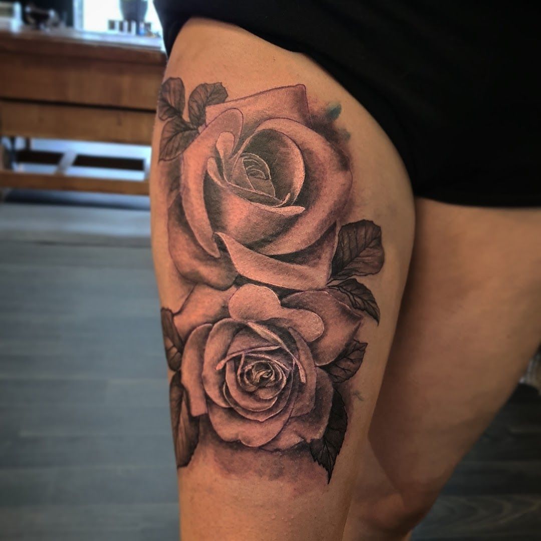 a black and white rose cover-up tattoo on the thigh, duisburg, germany